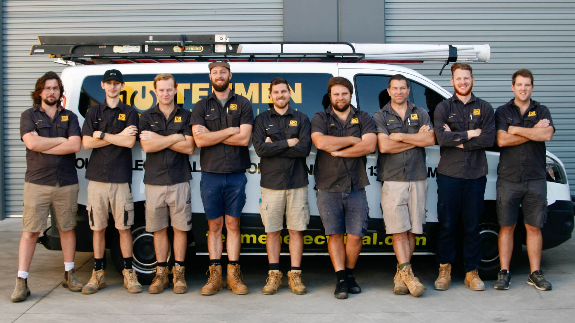 The Tenmen Electrical Baringa team of aircon technicians standing in front of a van the working van.